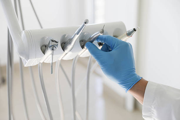 Professional Tooth Extraction technician working in Port Washington, NY